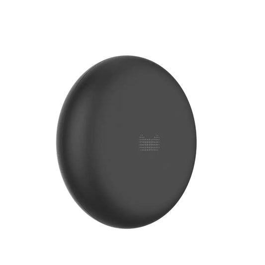 Black circular object with a textured surface on a white background