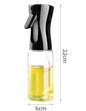 Portable cooking oil sprayer bottle filled with olive oil
