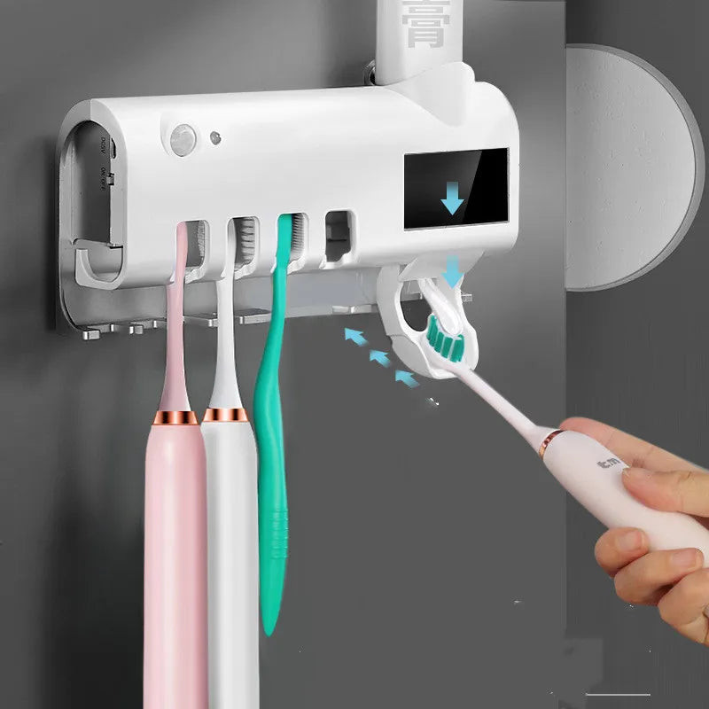 Wall mounted UV toothbrush holder sterilizing multiple brushes
